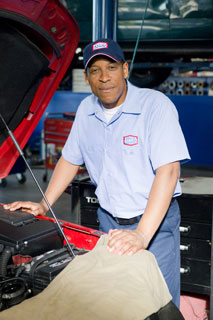 Image of AAMCO Mechanic over Engine