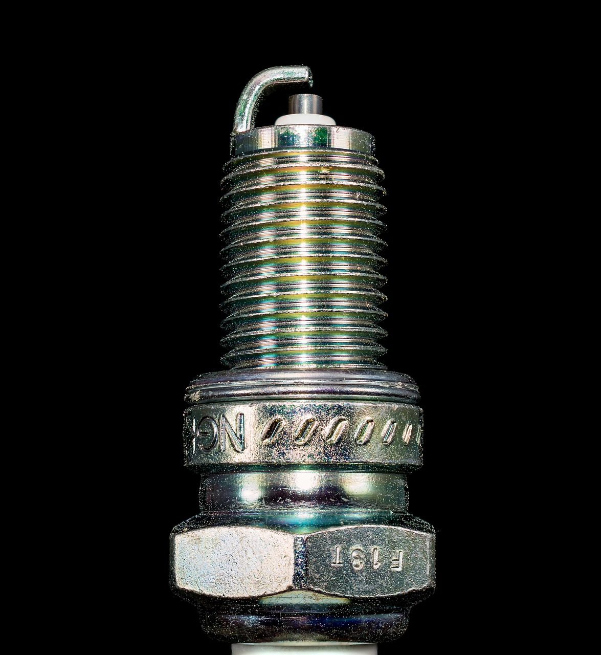 Image of a car spark plug. AAMCO KY